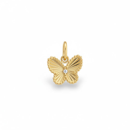 Gold butterfly charm with a small diamond on a white background