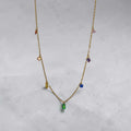 Necklace with colorful beads on a light gray background